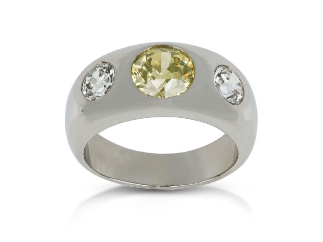Fancy intense yellow diamond three stone gypsy ring, circa 1950.