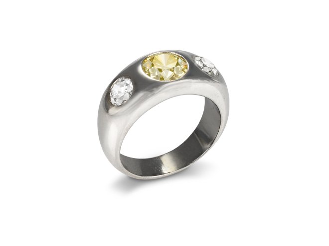 Fancy intense yellow diamond three stone gypsy ring, circa 1950.