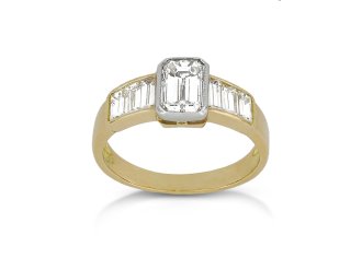 Emerald-cut diamond flanked solitaire ring, circa 1970s.