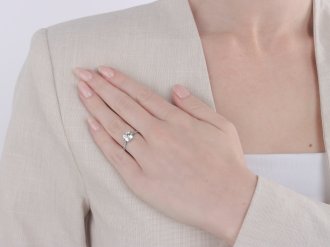 Old cut diamond flanked solitaire ring, circa 1915.