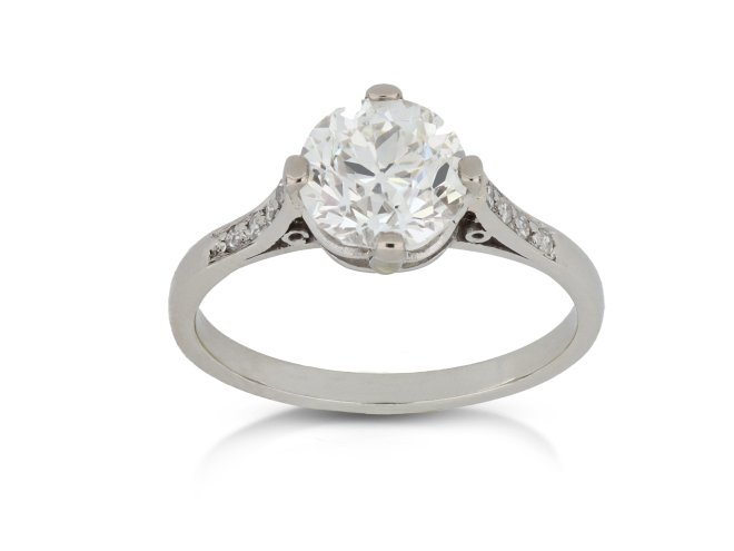 Old cut diamond flanked solitaire ring, circa 1915.