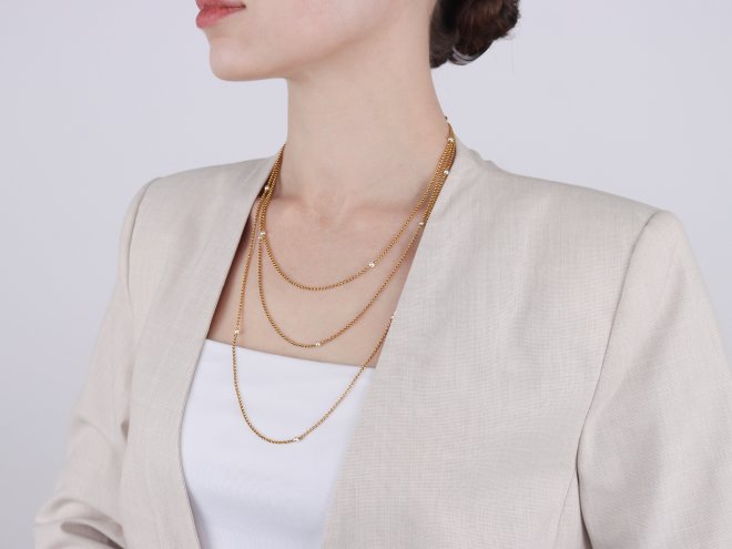 Yellow gold and pearl longuard chain, circa 1900. 