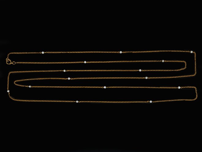 Yellow gold and pearl longuard chain, circa 1900. 