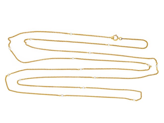 Yellow gold and pearl longuard chain, circa 1900. 
