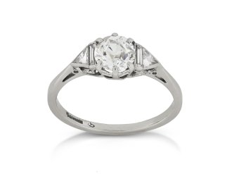 Art Deco diamond flanked solitaire ring, circa 1930. 