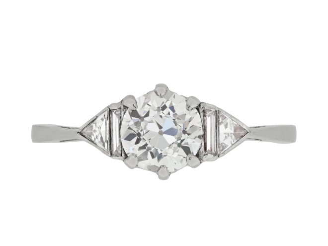 Art Deco diamond flanked solitaire ring, circa 1930. 