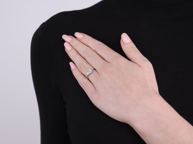 Art Deco diamond flanked solitaire ring, circa 1930. 