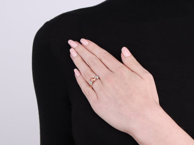 Padparadscha Ceylon sapphire and diamond three stone ring.