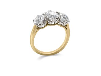 Old cut diamond three stone ring, circa 1910. 