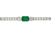 Colombian emerald and diamond bar brooch, circa 1920. 