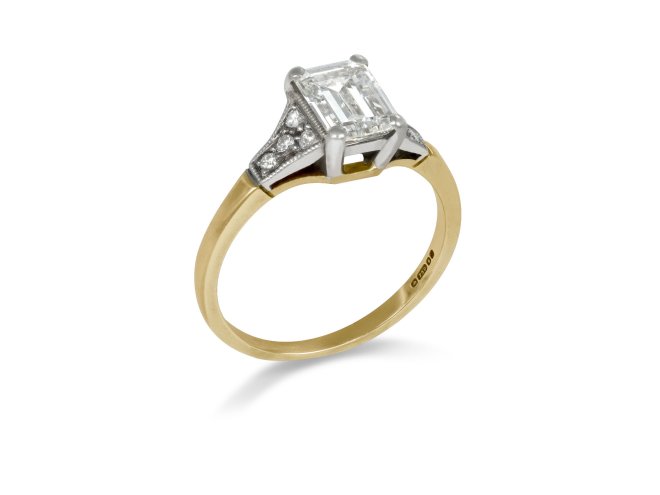 A diamond ring featuring an emerald cut centre stone