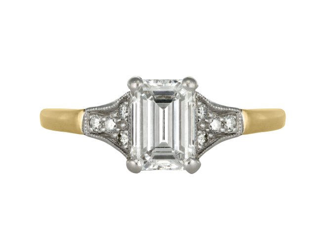 A diamond ring featuring an emerald cut centre stone