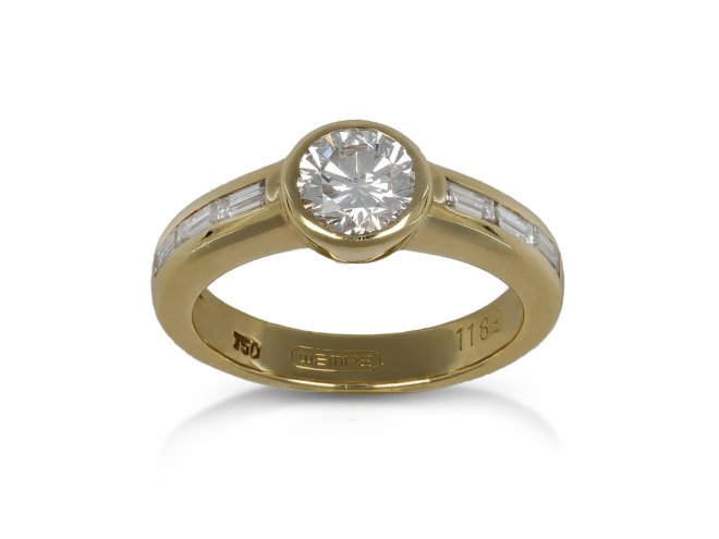 Diamond flanked solitaire ring by Wempe, German, circa 1970.