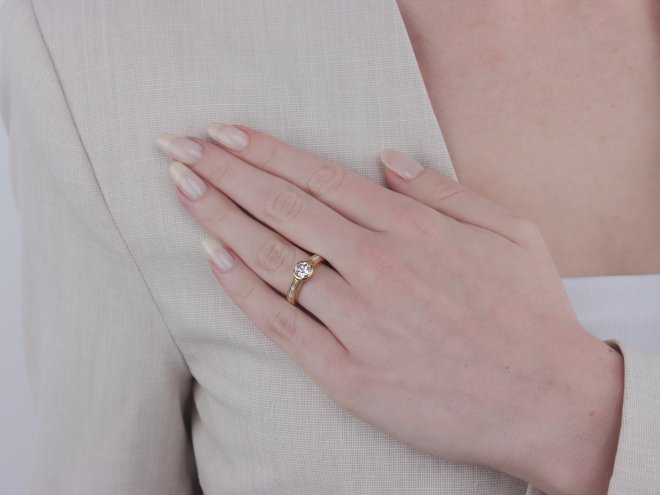 Diamond flanked solitaire ring by Wempe, German, circa 1970.