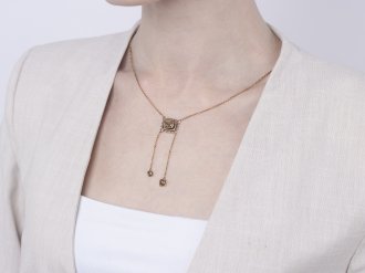 Fancy brown yellow diamond negligee pendant, circa 1915.