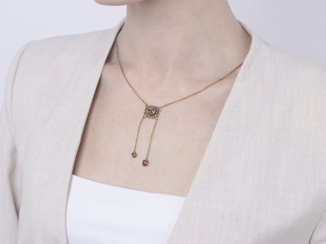 Fancy brown yellow diamond negligee pendant, circa 1915.