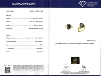 Green sapphire and diamond flanked solitaire ring. 