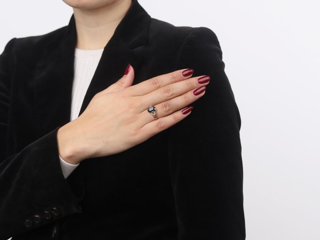 Green sapphire and diamond flanked solitaire ring. 