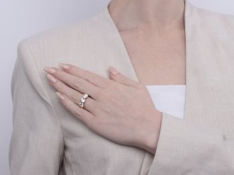 Old cut diamond three stone ring by Lawrence & Linguard, English, 1901. 