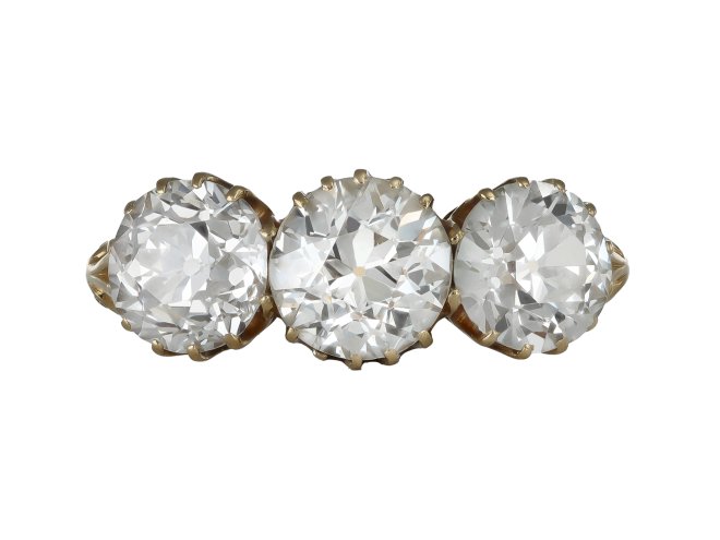 Old cut diamond three stone ring by Lawrence & Linguard, English, 1901. 