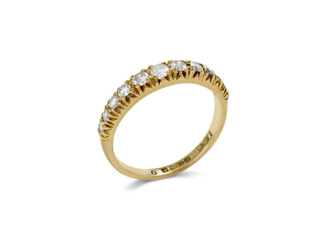 An 18ct yellow gold diamond half eternity ring