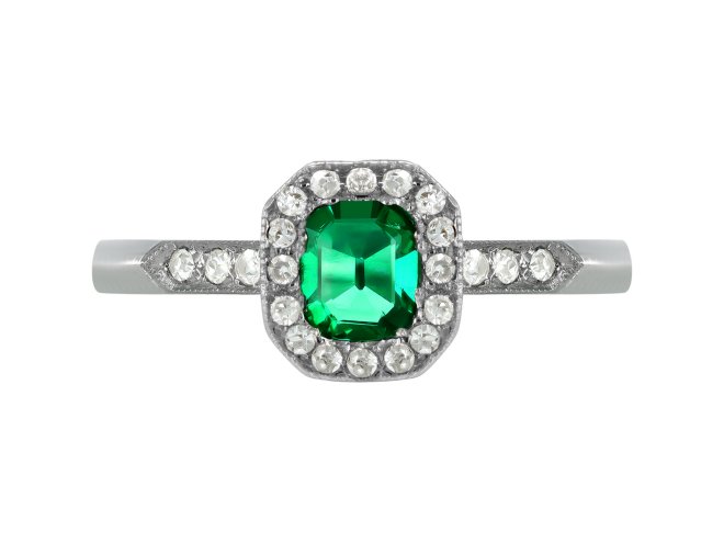 Emerald and diamond coronet cluster ring, circa 1950.
