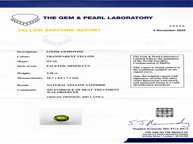 Yellow Ceylon sapphire and diamond flanked solitaire ring, circa 1970. 
