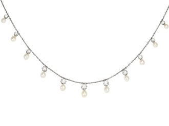 Natural pearl and diamond necklace, circa 1910. 