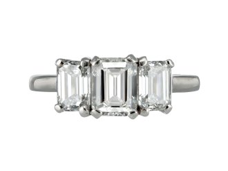 Emerald cut diamond three stone ring.
