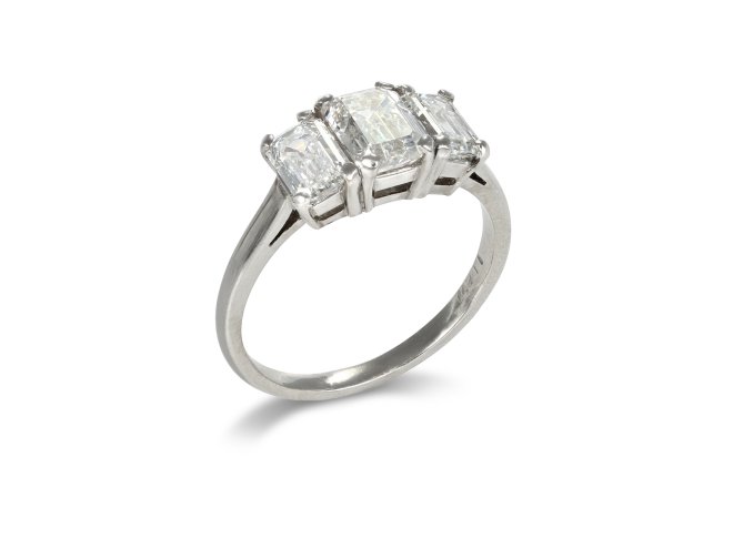 Emerald cut diamond three stone ring.