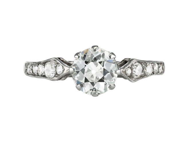 Diamond flanked solitaire ring, circa 1920. 