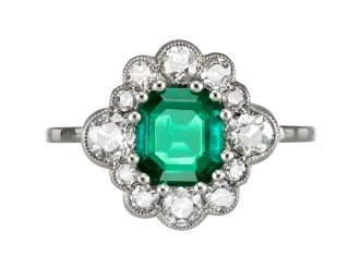 Emerald and diamond cluster ring, circa 1920. 