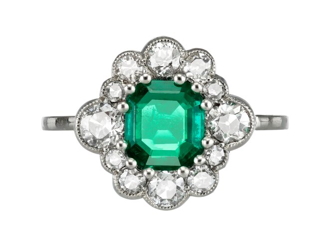 Emerald and diamond cluster ring, circa 1920. 