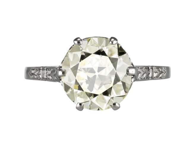 Old cut diamond flanked solitaire ring, circa 1920. 
