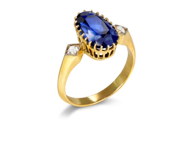 Ceylon sapphire and diamond three stone ring, early 20th century.
