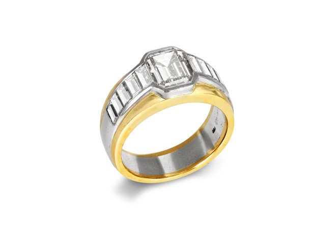 Diamond flanked solitaire ring by Friedrich, German, circa 1990.