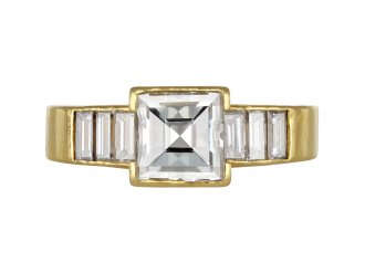Square step cut flanked solitaire diamond ring, English, 1987.