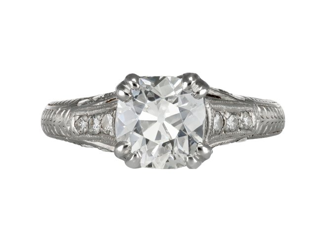 Diamond flanked solitaire ring, American circa 1940. 