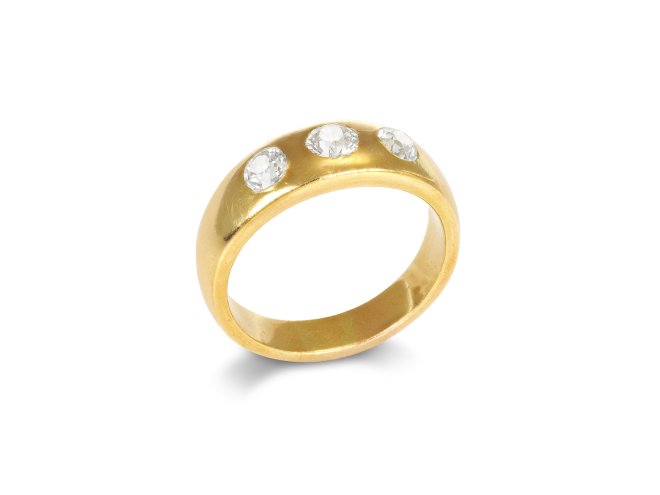 Diamond three stone gypsy ring, circa 1900.