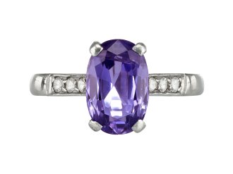 Purple Sapphire Flanked Solitaire ring, circa 1950. 