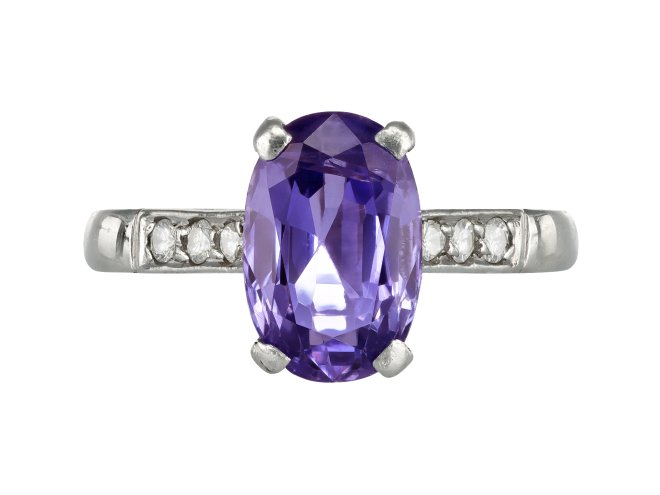 Purple Sapphire Flanked Solitaire ring, circa 1950. 