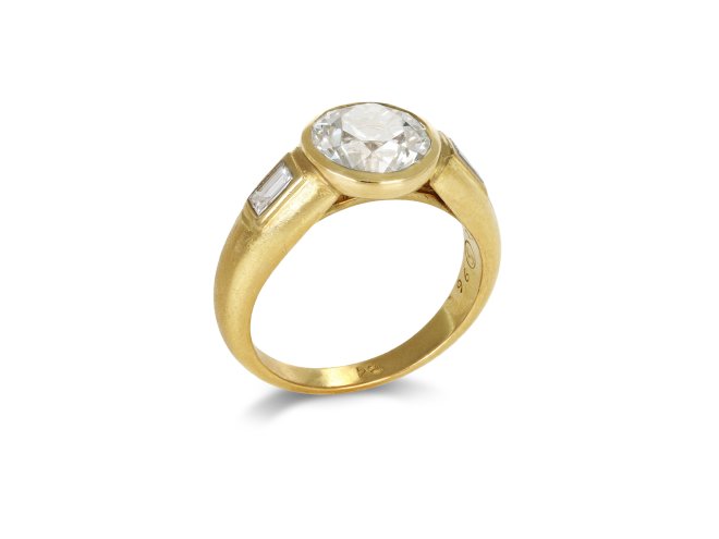 Diamond flanked solitaire, French, circa 1970.
