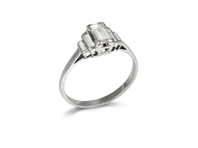Art Deco diamond flanked solitaire ring, 1935. 