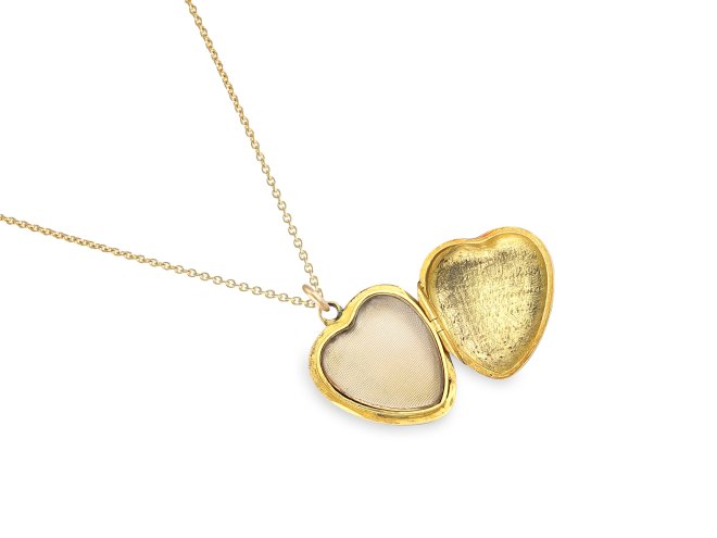 Enamel and diamond locket, circa 1900. 