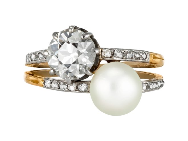 Natural pearl and diamond crossover ring, circa 1910. 