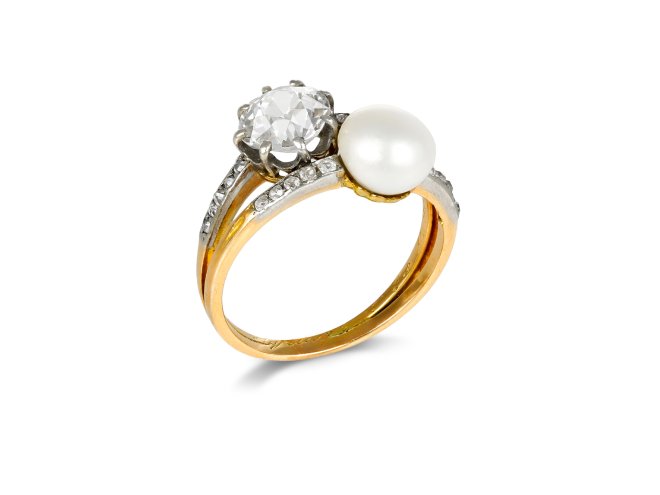 Natural pearl and diamond crossover ring, circa 1910. 