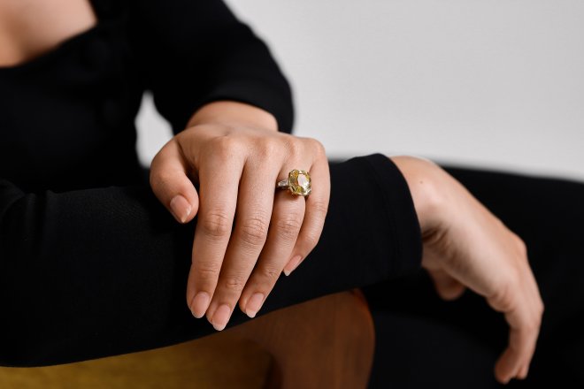Yellow Ceylon sapphire and diamond flanked solitaire ring. 