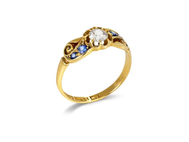 Victorian diamond and sapphire flanked solitaire ring, circa 1900.