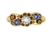 Victorian diamond and sapphire flanked solitaire ring, circa 1900.