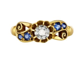 Victorian diamond and sapphire flanked solitaire ring, circa 1900.